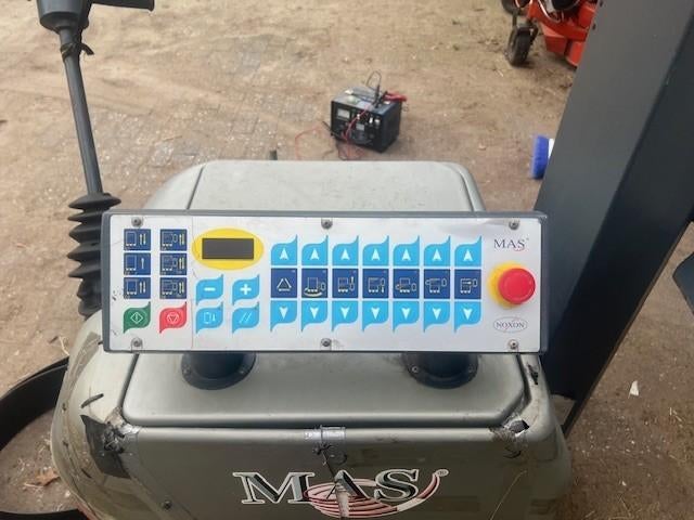 Palletwikkelmachine, Ophalen