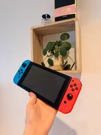 Nintendo switch plus 4 spelletjes en bakje voor op tv, Ophalen, Zo goed als nieuw