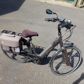 Elektrische herenfiets merk KOGA, Fietsen en Brommers, Elektrische fietsen, Ophalen, Gebruikt, 50 km per accu of meer