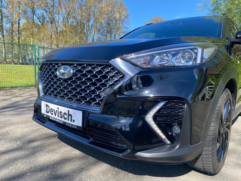 Hyundai Tucson 1.6 t-gdi isg n-line 2wd dct-7 5d 130kw, Gebruikt, 4 cilinders, Leder en Stof, Zwart