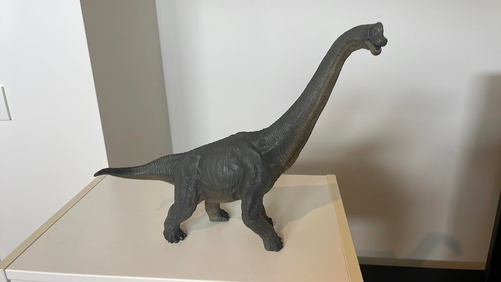 Een grijze dinosaurus ( hoogte en lengte 30 cm ), Verzamelen, Ophalen, Zo goed als nieuw