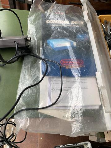 Nes met boekjes en game beschikbaar voor biedingen