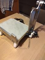 kaassnijmachine, Ophalen