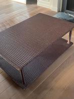 Gevlochten salontafel, Ophalen