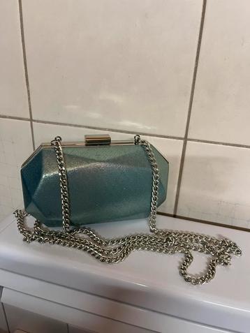 Clutch met hengsel beschikbaar voor biedingen