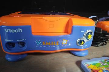 Vtech vsmile met 4 spellen beschikbaar voor biedingen