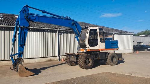 Hitachi EX165W, Zakelijke goederen, Machines en Bouw | Kranen en Graafmachines, Graafmachine, Ophalen of Verzenden