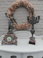 Bronzen ornament met kandelaar, Ophalen