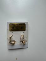 Oorbellen bedekt met een gouden laag., Ophalen
