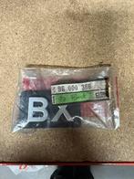 Nos Embleem achter Citroen bx, Ophalen