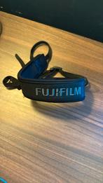 Bandoulière Fujifilm, Ophalen