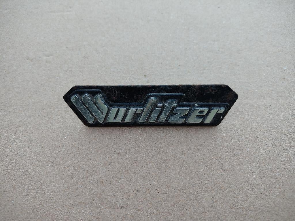 Embleem Wurlitzer (Div) jukebox, Envoi, Wurlitzer