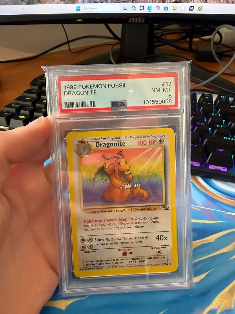 Dragonite 1999 fossil psa 8, Ophalen of Verzenden, Zo goed als nieuw