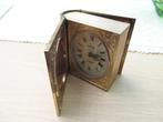 Horloge de voyage à livre en métal doré, Antiquités & Art, Enlèvement ou Envoi