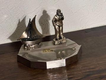 Metalen souvenir asbakje De Haan, (Le Coq) beschikbaar voor biedingen