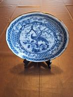 Decoratief porselein bord blauw, Enlèvement