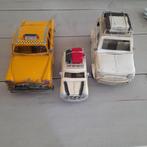 Drie tinnen auto's., Ophalen