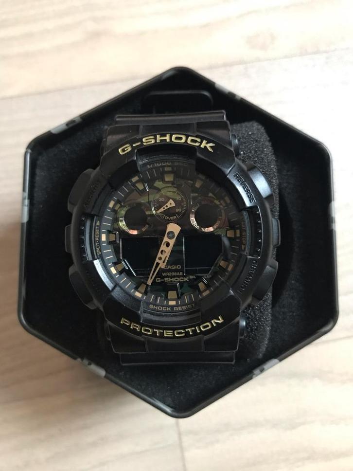 Horloge Casio G-Shock GA-100CF, Handtassen en Accessoires, Horloges | Heren, Gebruikt, Polshorloge, Casio, Kunststof, Kunststof
