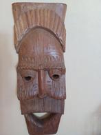 houten  masker, Ophalen