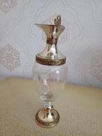 Schenkkan glas met zilver, Ophalen