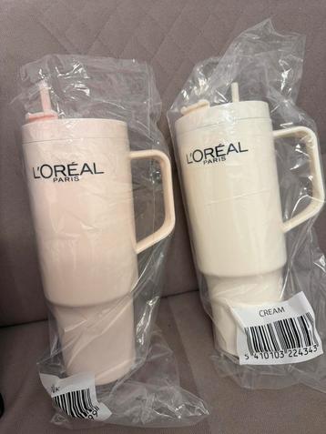 Nieuwe roze en crèmekleurige flessen van L'Oréal beschikbaar voor biedingen