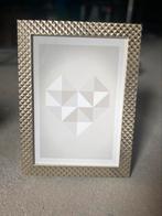 Fotokader gouden rand, Ophalen