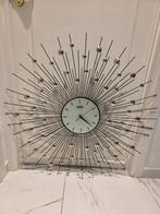 Te koop: Designer wandklok – iconisch sunburst design, Ophalen of Verzenden, Zo goed als nieuw, Wandklok