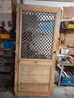 Antieke deur met gietijzeren frame, Ophalen