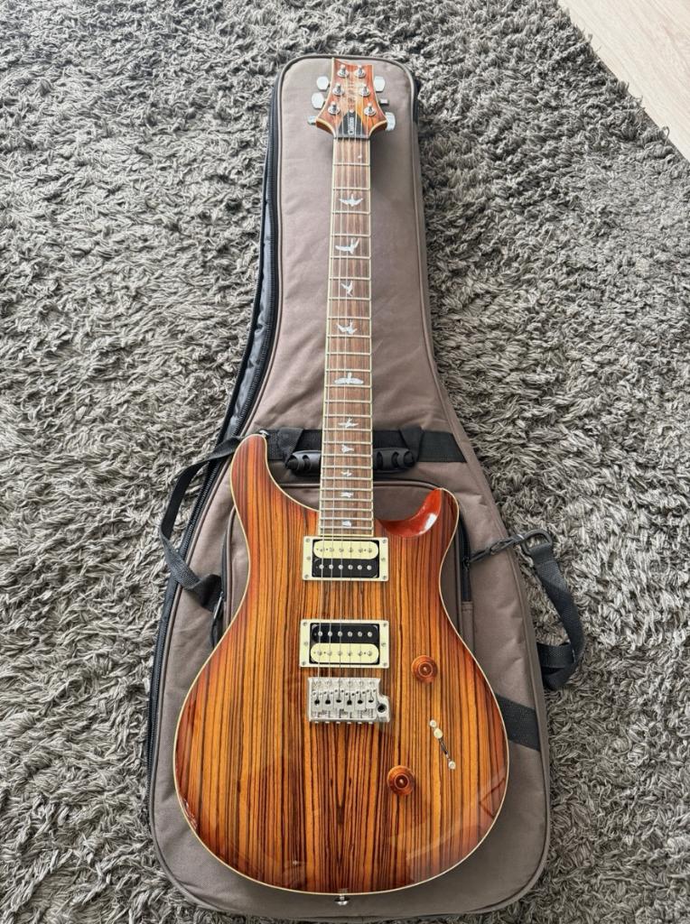 PRS SE Custom 24 Exotic Zebrawood Vintage Sunburst, Muziek en Instrumenten, Snaarinstrumenten | Gitaren | Elektrisch, Gebruikt