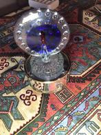 Mondgeblazen Pauw op muziekdoos, Ophalen