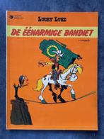 Strip Lucky Luke - De éénarmige bandiet, Gelezen, Ophalen of Verzenden, Eén stripboek
