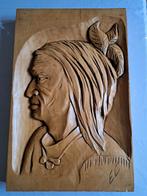 une sculpture sur bois en bas-relief, Enlèvement ou Envoi