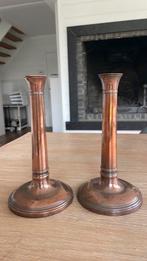 Koperen kandelaars, Ophalen