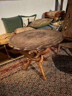 Table basse africaine, Ophalen