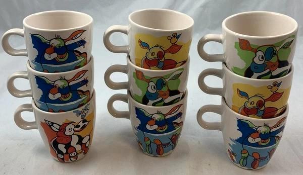 Douwe Egberts 9x Senseo Mok Nikolai Carels Mosa Rebel Koe DE, Huis en Inrichting, Keuken | Servies, Zo goed als nieuw, Kop(pen) en/of Schotel(s)