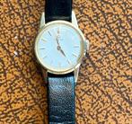 Omega, 18k gouden postzegel, dame rond 1960/65, Handtassen en Accessoires, Horloges | Dames, Polshorloge, Goud, Ophalen, Overige merken