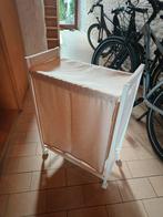 Wasmand op wielen., Ophalen