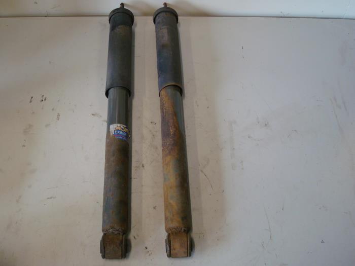 Schokdemperpoot links-achter van een Mercedes 200 - 500, Auto-onderdelen, Ophanging en Onderstel, Mercedes-Benz, Gebruikt, 3 maanden garantie