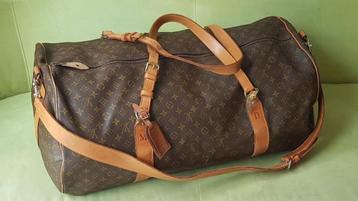 Sac Polochon XXL Louis Vuitton vendu avec sa facture. 