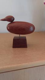 Eendje uit Padoek hout, Ophalen