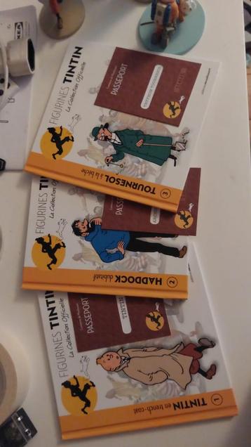 3 figurines tintin  disponible aux enchères