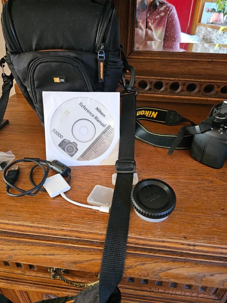 Nikon digitale camera met alles erop en eraan, Ophalen