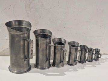 7 tinnen maatbekers,  1 liter tot 1cl , gestempeld 90% tin beschikbaar voor biedingen