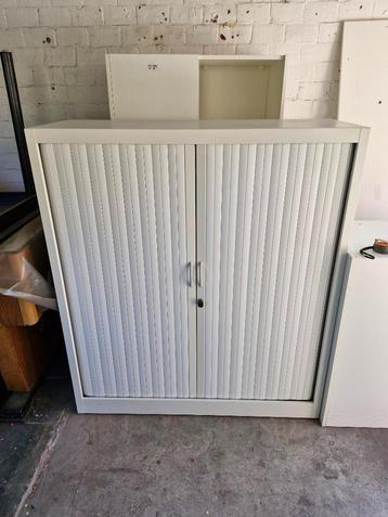 Strakke hoge witte roldeurkast !, Huis en Inrichting, Kasten | Roldeurkasten en Archiefkasten, Ophalen, 100 tot 150 cm, 100 tot 150 cm