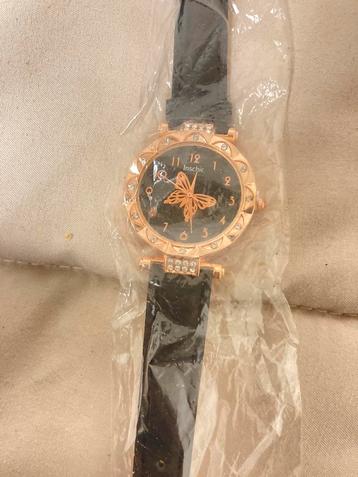 Rosé en zwartkleurige horloge nieuw met vlindertje