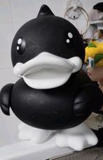 Grote duck eend kop kan eraf spaarpot, Ophalen