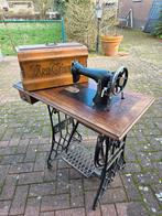 Oude Triumph-naaimachine., Ophalen