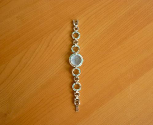 Zilverkleurig horloge met blauwe cirkels en strass van Kimio, Handtassen en Accessoires, Armbanden, Ophalen of Verzenden
