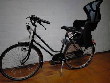 Damesfiets met kinderzitje beschikbaar voor biedingen