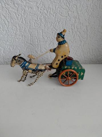 Oude blikken clown beschikbaar voor biedingen